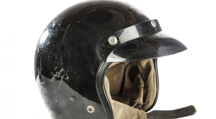 Black used vintage motorcycle helmet isolated on white